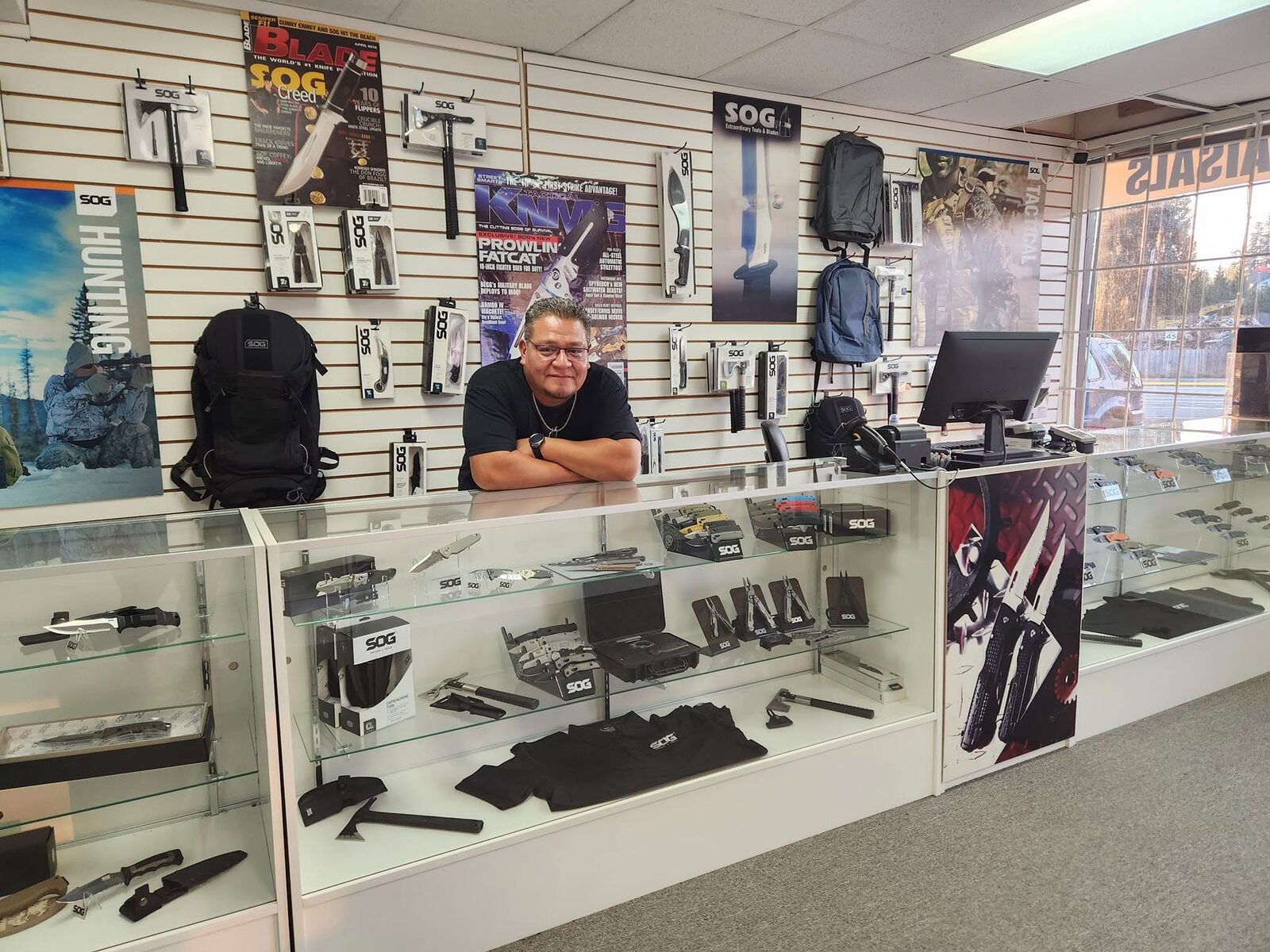 Gio Guajardo behind the counter at NorthWest Tactical Knives