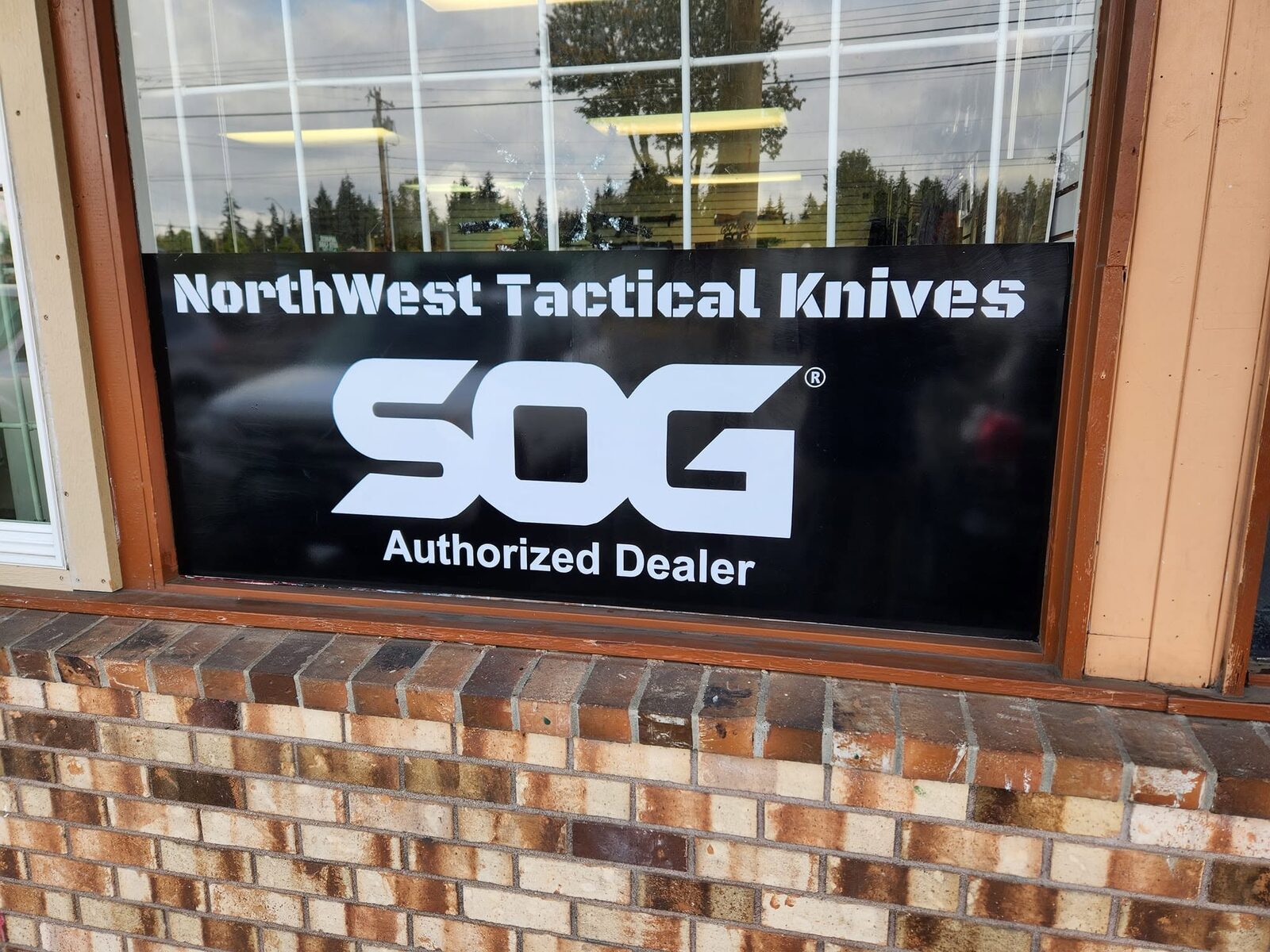 The NorthWest Tactical Knives storefront window — SOG Authorized Dealer